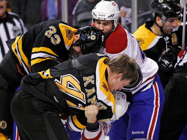 Bruins defensemen Zdeno Chara (33) and Steve Kampfer (47) fight with Canadiens defenseman Roman Hamrlik  