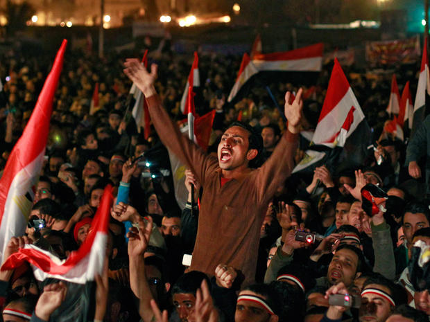 Egyptians celebrate the news of the resignation of President Mubarak 