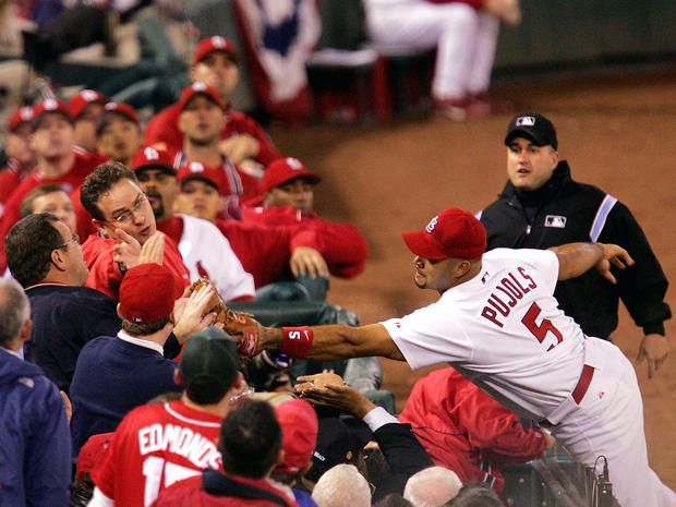 Albert Pujols dives for a foul ball just 