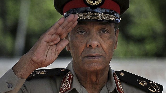 Egyptian Minister of Defense Mohamed Hussein Tantawi stands next to Defense Secretary Robert Gates, not seen, during the playing of the U.S. national anthem at the Ministry of Defense in Cairo before reviewing troops.  