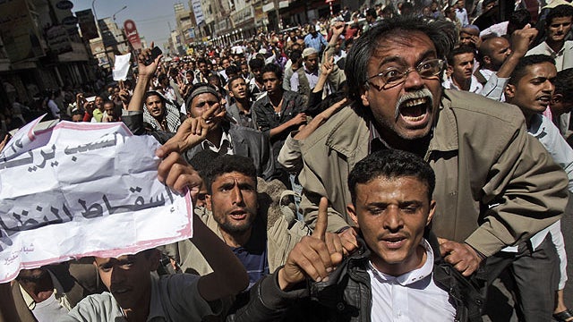 Yemeni anti-government demonstrators react during a demonstration demanding the resignation of President Ali Abdullah Saleh in Sanaa, Yemen 