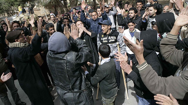 In this photo released by China's Xinhua News Agency, anti-government protesters celebrate in the east Libyan city of Albayda 