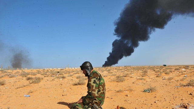 Government troops drove opposition forces out of the strategic oil town Ras Lanuf, Libya.   