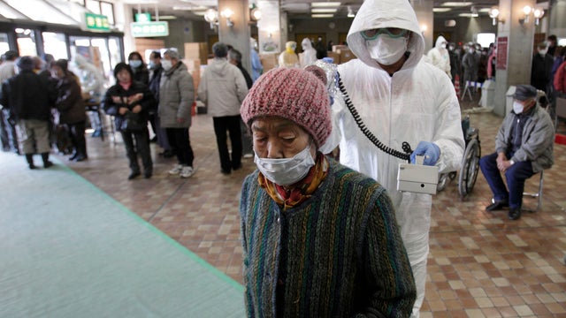 Japanese woman scanned for radiation 