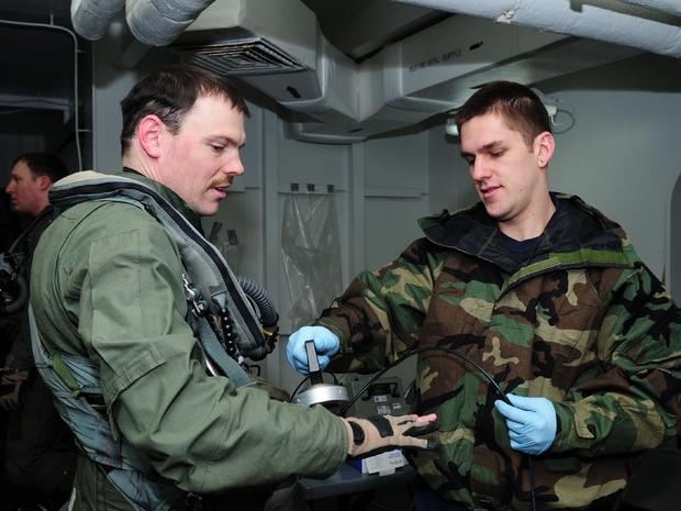 Navy personnel check radiations levels off the coast of Japan, March 18, 2011 