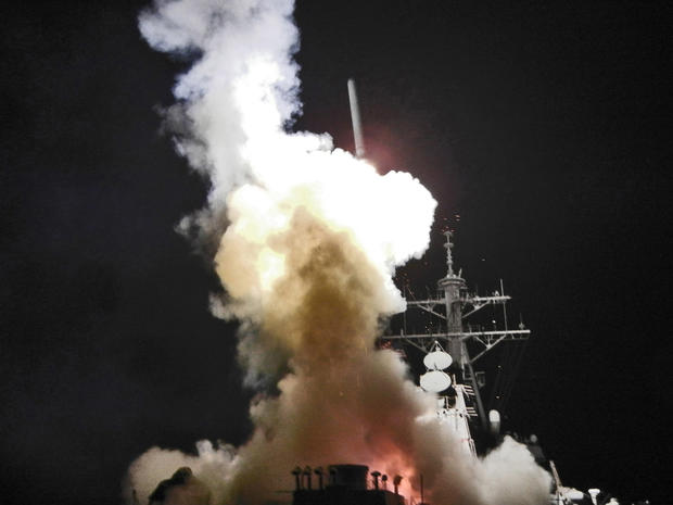  Arleigh Burke-class guided-missile destroyer USS Barry (DDG 52) launches a Tomahawk missile in support of Operation Odyssey Dawn 