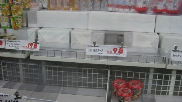 Empty shelves in Tokyo after a run on groceries by a nervous public.  