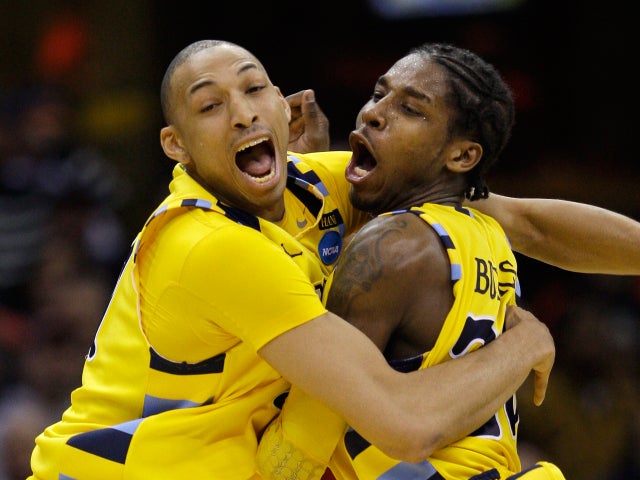 Marquette's Joseph Fulce, left, and Dwight Buycks celebrate 