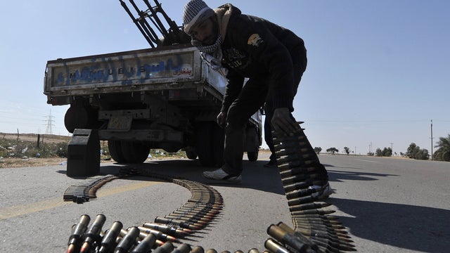 Rebel fighter mans anti-aircraft gun near Ajdabiya, Libya 