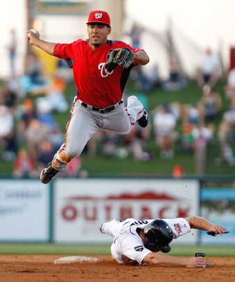 Jeff Carter battles for the puck with  Zbynek Michalek 