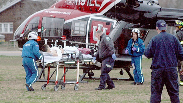 A student is wheeled to a waiting Lifeline helicopter, March 25, 2011, at West Middle School in Martinsville, Ind. A person was shot Friday at the middle school in south-central Indiana and a suspect is in custody, state police said.  
