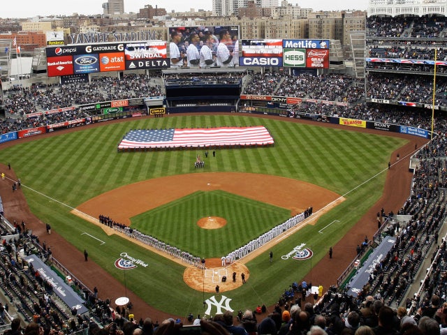 Fans look on during the playing of the national anthem 