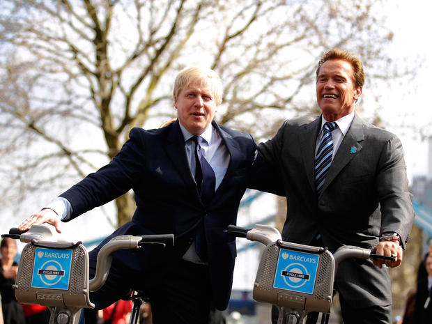 London Mayor Boris Johnson and Arnold Schwarenegger on bikes in London. 
