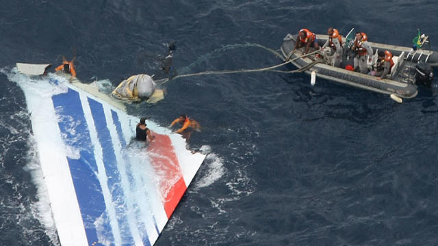 In this Monday, June 8, 2009 file photo released by Brazil's Air Force, Brazil's Navy sailors recover debris from the missing Air France Flight 447 in the Atlantic Ocean. Undersea robots have located a "large part" of an Air France jet that plunged into t 