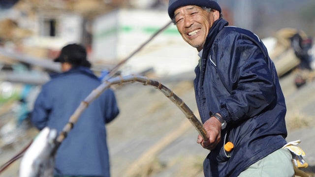 Japanese man catches a salmon in Ishinomaki, northern Japan 