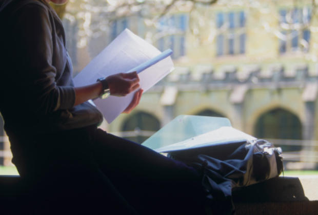 College student studying in campus courtyard 