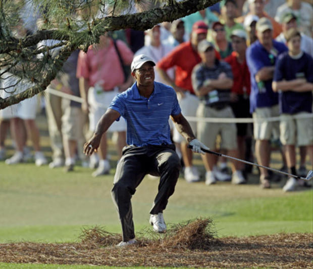 Tiger Woods nearly falls backwards  
