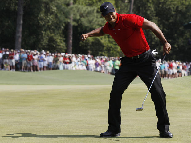 Tiger Woods reacts after an eagle putt 