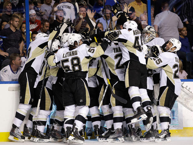 Pittsburgh Penguins players mob James Neal 