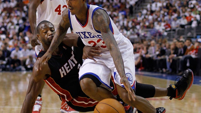 Dwyane Wade gets a hand on 76ers' Lou Williams 