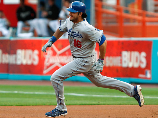 Andre Ethier rounds first base after hitting a double  