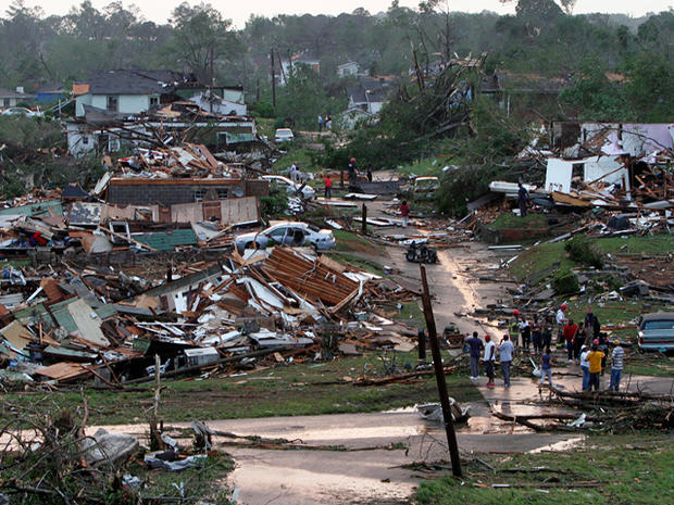 Residents survey the destruction after a tornado  