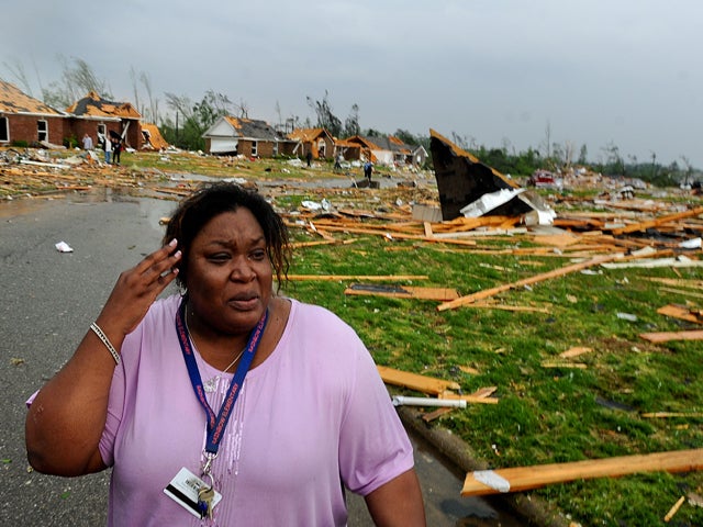 Tamisha Cunninghamwhile looks over the damage  