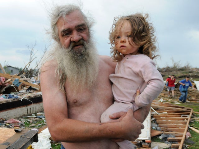 Willie Hyde holds his grand daughter 2-years-old Sierra Goldsmith 