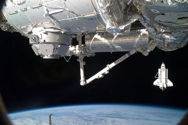 Taken by a member of Expedition 22 from aboard the International Space Station, this image shows Endeavour shortly after undocking from the ISS on Feb. 19, 2010. In the foreground is the newly-installed Tranquility node and Cupola, along with the Canadarm 