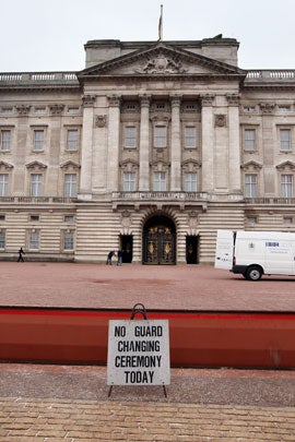 Workmen rake gravel on the forecourt of Buckingham Palace on April 28, 2011, in London. With less than 24 hours to go, final preparations for the wedding of Prince William and Catherine Middleton are in place. 