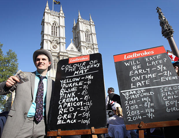 A bookie takes bets outside Westminster Abbey on April 27, 2011, in London. 