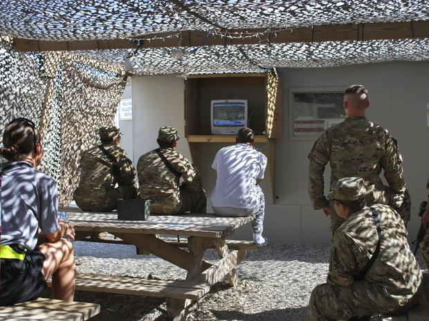 U.S. soldiers and service members watch the cable news coverage of the death of al-Qaida leader Osama bin Laden on a television at the Bagram air field  