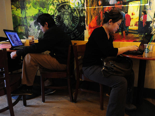 Beijing residents on laptops at a coffee shop 