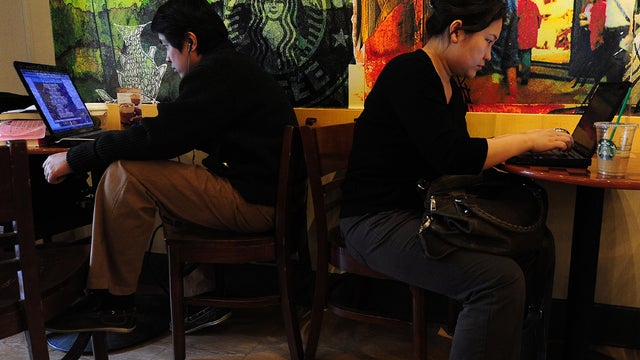 Beijing residents on laptops at a coffee shop 