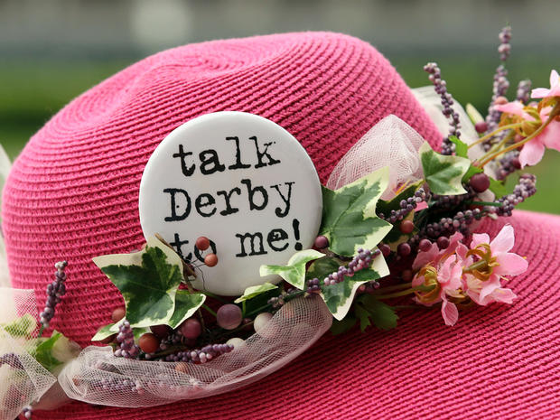 A hat with a pin on it that reads "Talk derby to me!" is seen during the 137th Kentucky Derby at Churchill Downs on May 7, 2011, in Louisville, Ky. 