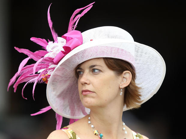 A fan looks on from the stands while she wears her derby hat during the 137th Kentucky Derby at Churchill Downs on May 7, 2011, in Louisville, Ky. 