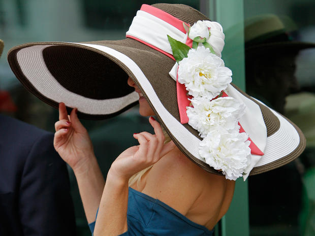 A spectator shows off her Derby hat before the 137th Kentucky Derby horse race at Churchill Downs Saturday, May 7, 2011, in Louisville, Ky.  