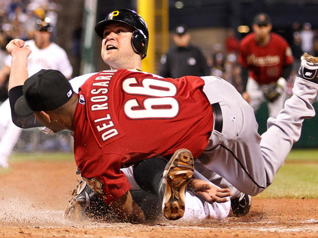 Pittsburgh Pirates' Chris Snyder slides under the tag 