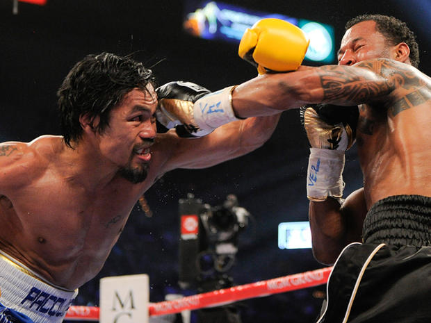 Manny Pacquiao throws a punch against Shane Mosley 