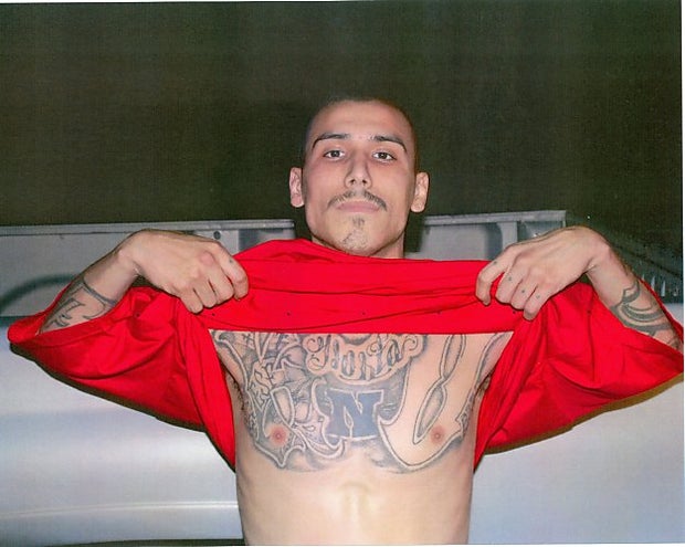 Slaying suspect may be posing as twin brother 