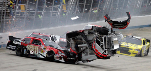 Clint Bowyer, right, collides with Joey Logano 