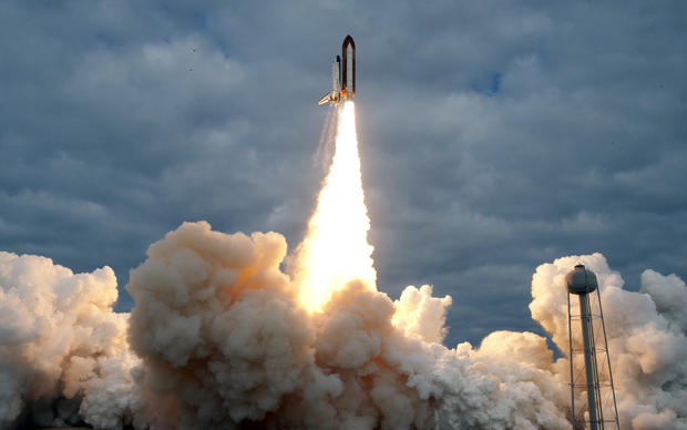 The Space Shuttle Endeavour lifts off on 