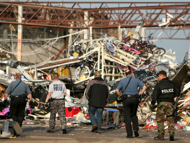 Rescue worker and dog search for tornado survivors in Joplin 