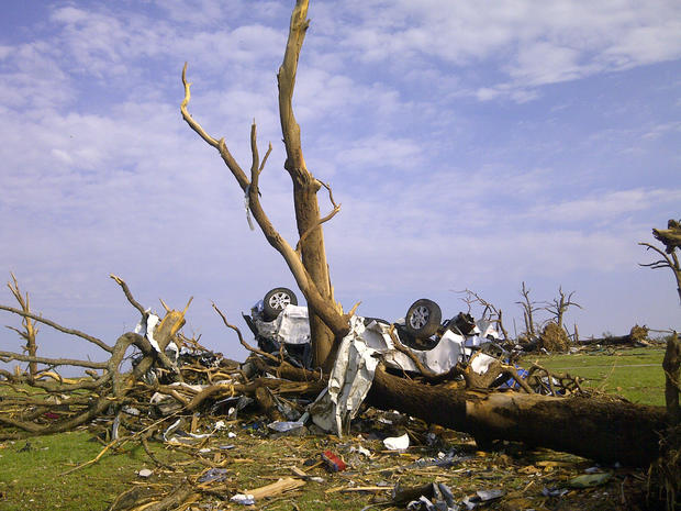 Tornado aftermath of a car wrapped around a tree in Joplin, Missouri 