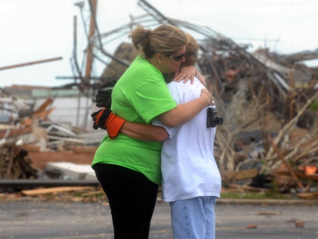 Kelsee Shanks hugs Theresa Adams, of Joplin, Mo. 