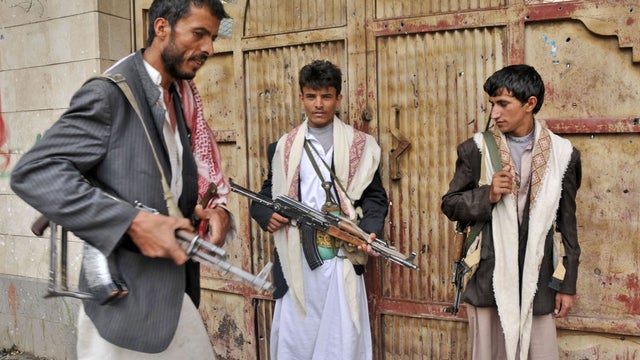Armed tribesman loyal to Sheik Sadeq al-Ahmar, head of the powerful Hashid tribe, guard street in Sanaa, Yemen, Saturday, May 28, 2011. Islamic militants seized Sanaa Sunday, and government warplanes attacked it Monday. 