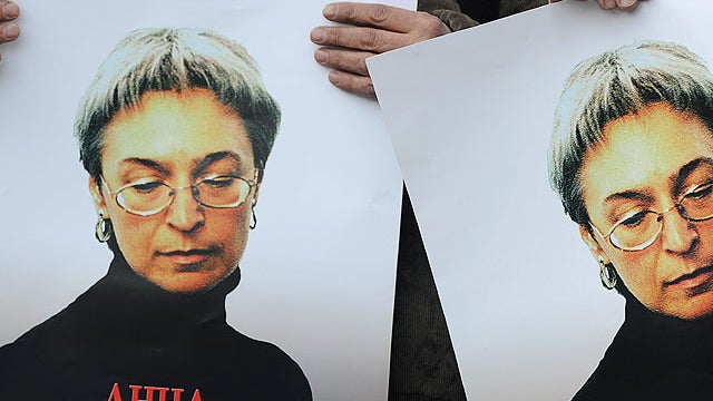 Russian human rights activists attend a rally in honour of slain Russian journalist Anna Politkovskaya in Moscow on October 7, 2010.  