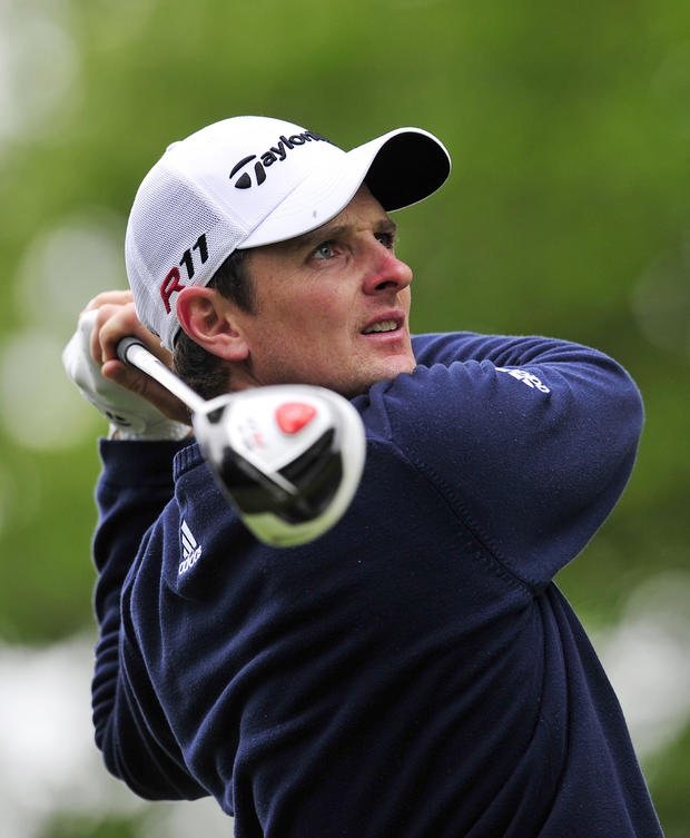 English golfer Justin Rose watches his d 