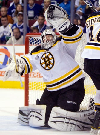 Tim Thomas makes a save  