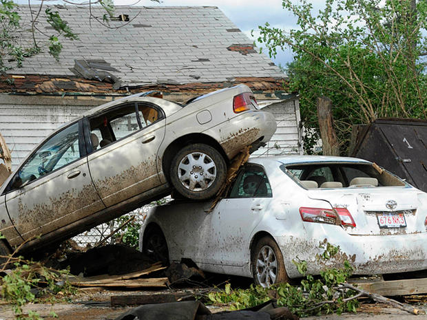 car piled on top another from a tornado  